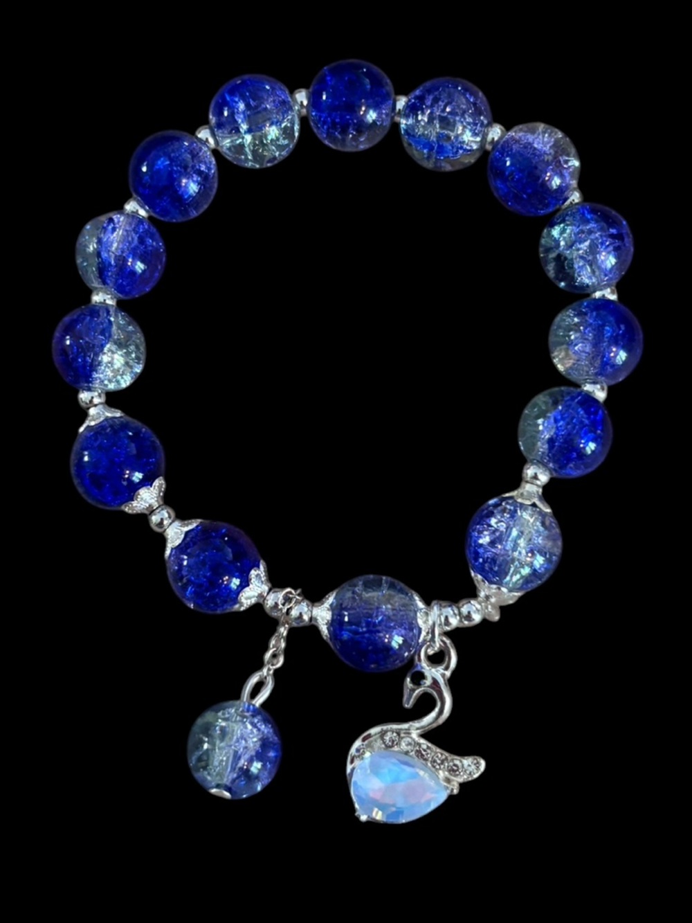 Blue Crackle Bead Stretch Bracelet w/ Swan Charm. Silver Tone Hardware